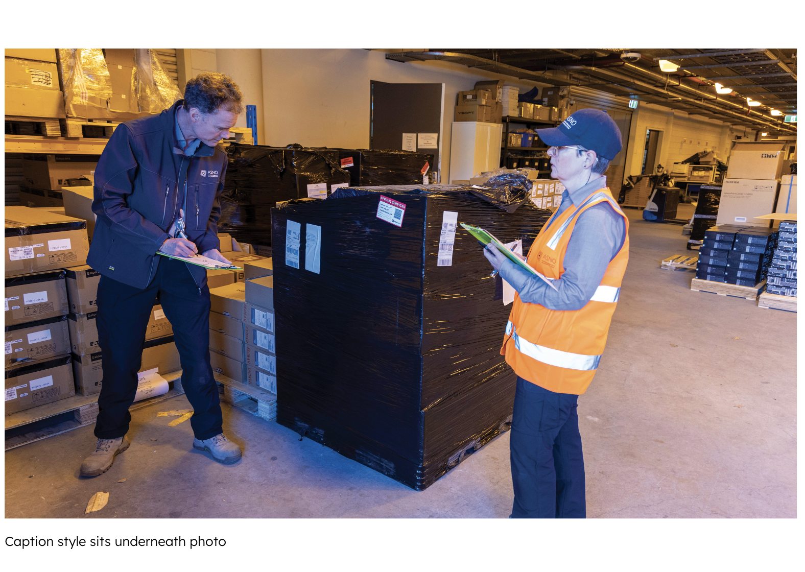 two men inspecting boxes