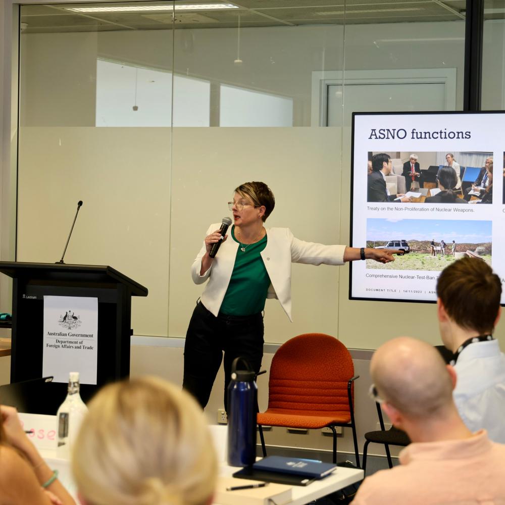 Felicity standing in front of room delivering a presentation