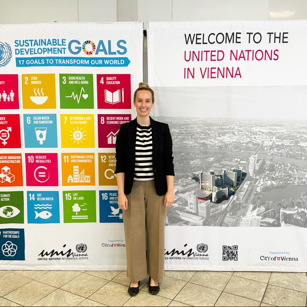 Sophie standing in front of banners